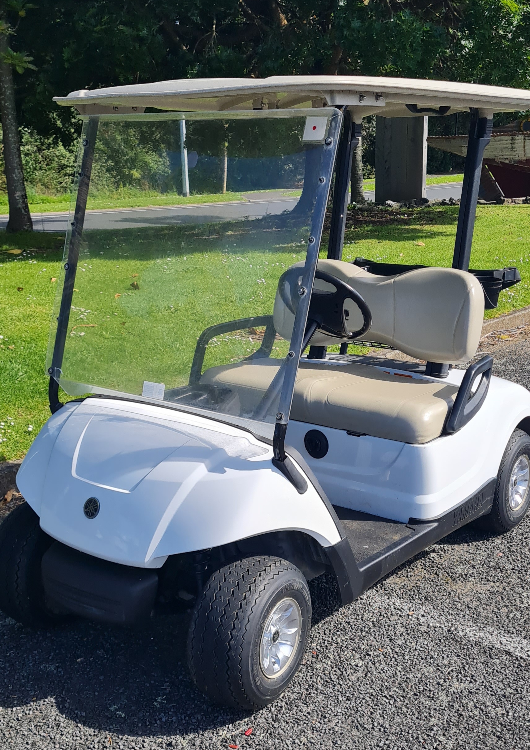 White Yamaha Drive golf cart in showroom-ready condition